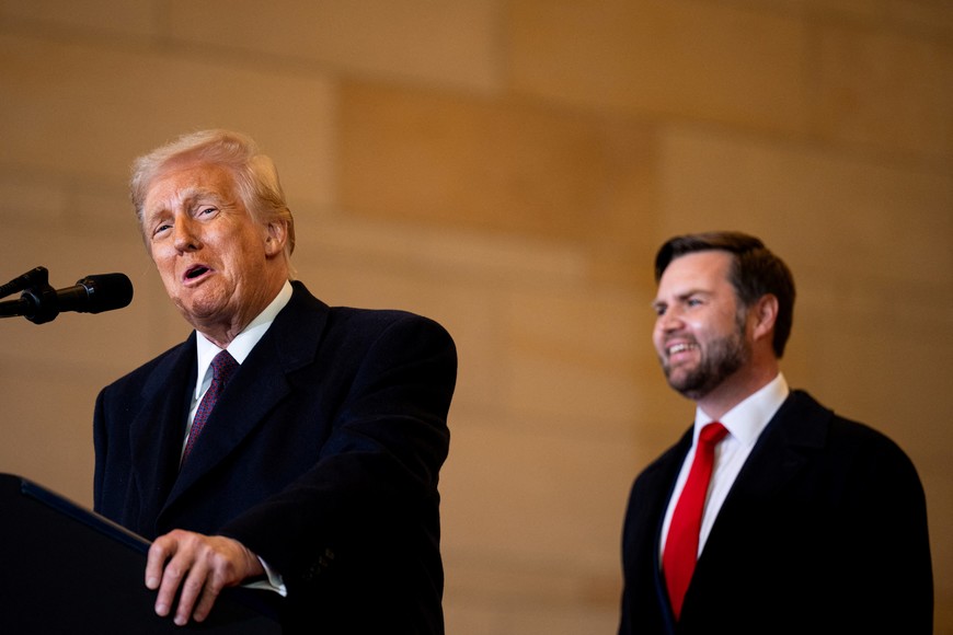 UNITED STATES - JANUARY 20: President Donald Trump speaks to the crowd as Vice President JD Vance looks on in the VIP overflow viewing area in Emancipation Hall after being sworn in as the 47th President of the United States in the U.S. Capitol on Monday, January 20, 2025. Bill Clark/Pool via REUTERS