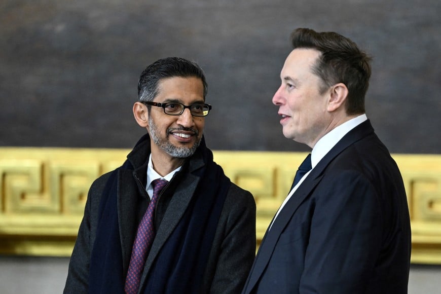 (L-R) Google CEO Sundar Pichai speaks with Tesla and SpaceX CEO Elon Musk as they arrive for the inauguration ceremony before Donald Trump is sworn in as the 47th US President in the US Capitol Rotunda in Washington, DC, on January 20, 2025.     Saul Loeb/Pool via REUTERS