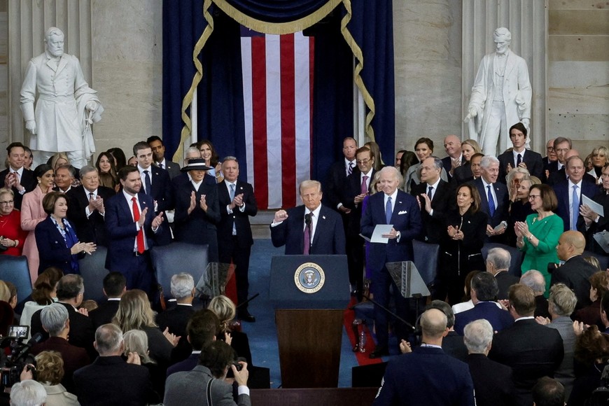 The U.S. President Donald Trump raises his fist after taking the oath on the day of his Presidential Inauguration at the Rotunda of the U.S. Capitol in Washington, U.S. January 20, 2025. REUTERS/Fabrizio Bensch/Pool            SEARCH "TRUMP INAUGURATION PICTURES" FOR THIS STORY. SEARCH "WIDER IMAGE" FOR ALL STORIES.           TPX IMAGES OF THE DAY