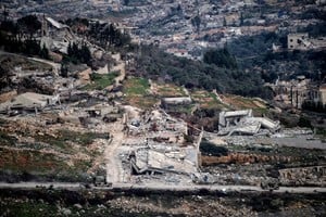 Israeli military vehicles drive past destruction in southern Lebanon, as seen from northern Israel, after a ceasefire between Israel and Hezbollah took effect, January 26, 2025. REUTERS/Gil Eliyahu   ISRAEL OUT. NO COMMERCIAL OR EDITORIAL SALES IN ISRAEL     TPX IMAGES OF THE DAY