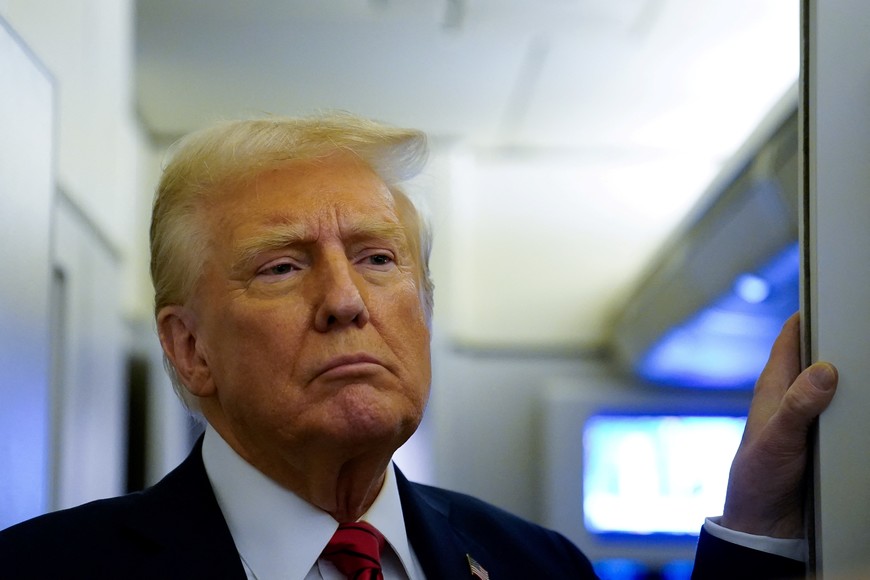 U.S. President Donald Trump speaks to reporters aboard Air Force One before arriving at Joint Base Andrews, Maryland, U.S., January 27, 2025. REUTERS/Elizabeth Frantz