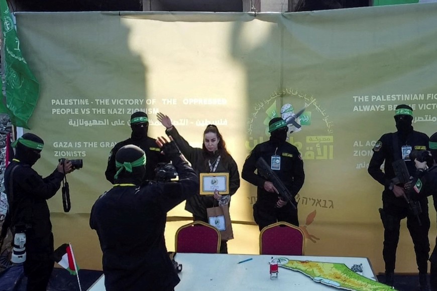 A drone view shows female Israeli soldier Agam Berger gestures as she is released by Palestinian Hamas militants, as part of a ceasefire and a hostages-prisoners swap deal between Hamas and Israel, in Jabalia, in the northern Gaza Strip, January 30, 2025. REUTERS/Mohammed Salem