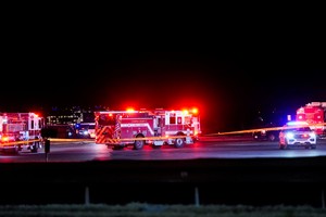 Emergency services operate at Gravelly Point, after American Eagle flight 5342 collided with a helicopter while approaching Reagan Washington National Airport and crashed in the Potomac River, in Arlington, Virginia, U.S. January 29, 2025. REUTERS/Elizabeth Frantz