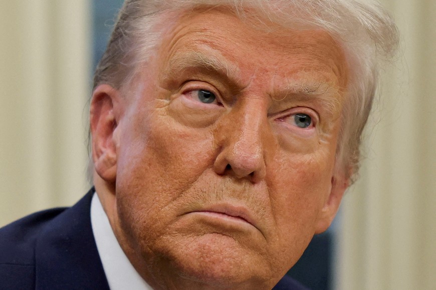 FILE PHOTO: U.S. President Donald Trump looks on, on the day he signs an executive order in the Oval Office at the White House in Washington, U.S., January 31, 2025. REUTERS/Carlos Barria/File Photo