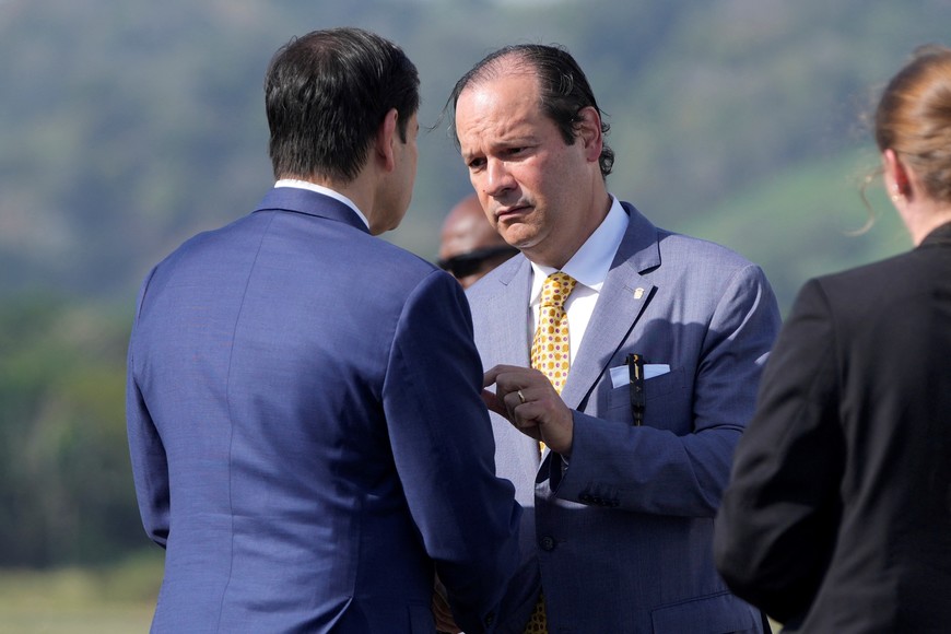 U.S. Secretary of State Marco Rubio speaks with Panama's Foreign Minister Javier Martinez-Acha before boarding a plane en route to El Salvador, at Panama Pacifico International Airport near Panama City, Panama, Feb. 3, 2025.     Mark Schiefelbein/Pool via REUTERS