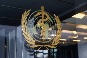 FILE PHOTO: The World Health Organization logo is pictured at the entrance of the WHO building, in Geneva, Switzerland, December 20, 2021. REUTERS/Denis Balibouse/File Photo