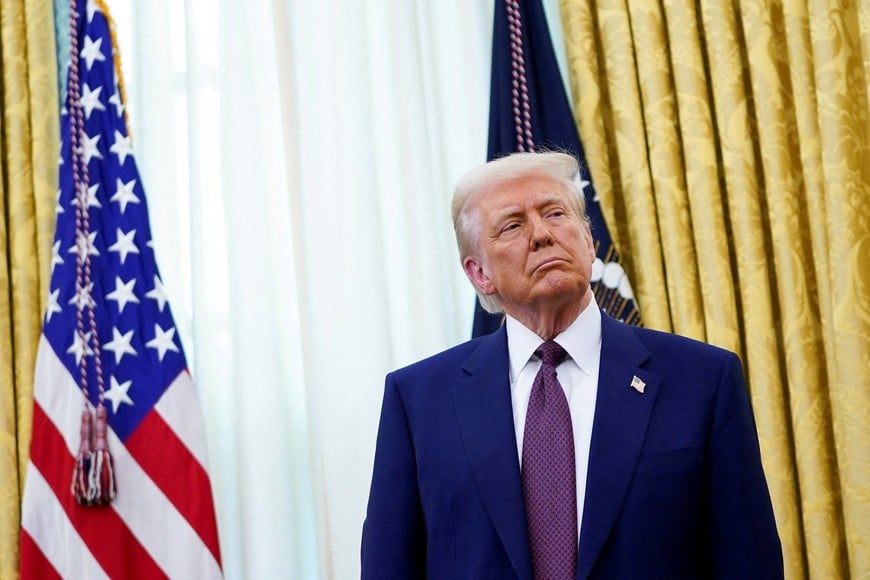 U.S. President Donald Trump looks on as he stands in the Oval Office of the White House, on the day Robert F. Kennedy Jr is sworn in as secretary of Health and Human Services, in Washington, D.C., U.S., February 13, 2025. REUTERS/Nathan Howard