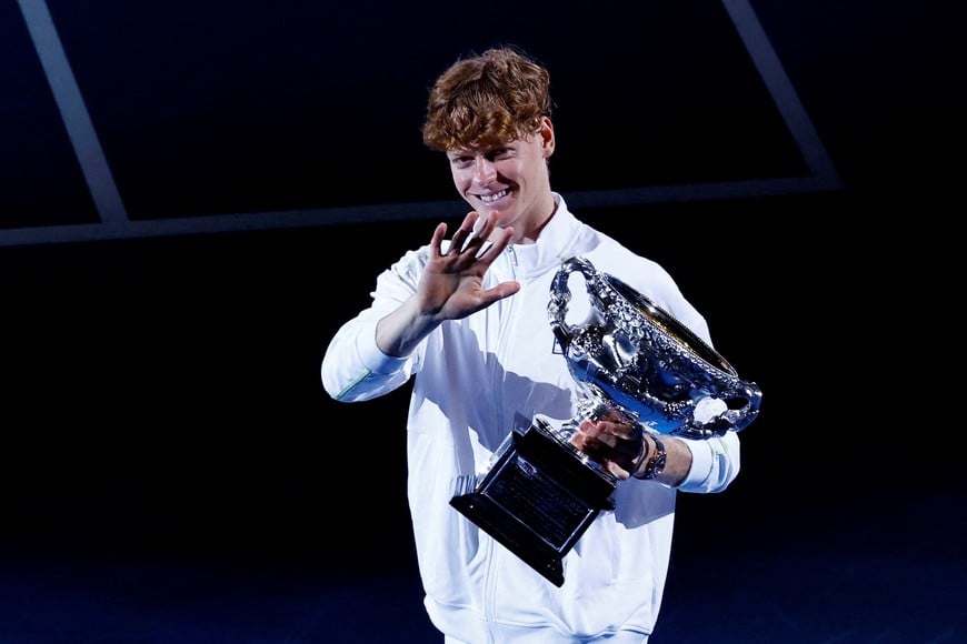 Tennis - Australian Open - Melbourne Park, Melbourne, Australia - January 26, 2025
Italy's Jannik Sinner celebrates with the trophy after winning the final against Germany's Alexander Zverev REUTERS/Kim Kyung-Hoon     TPX IMAGES OF THE DAY