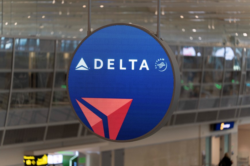 A Delta Air Lines sign hangs at Minneapolis–Saint Paul International Airport in St. Paul, Minnesota, U.S. February 17, 2025. A Delta plane which departed Minneapolis crashed at Toronto Pearson International Airport earlier in the day. REUTERS/Tim Evans