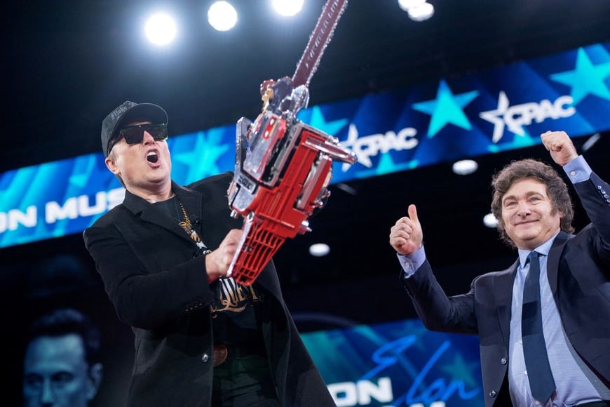 Elon Musk displays a chainsaw given to him by President of Argentina Javier Milei during the Conservative Political Action Conference (CPAC) in National Harbor, Maryland, U.S., February 20, 2025. REUTERS/Nathan Howard     TPX IMAGES OF THE DAY