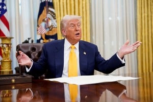 U.S. President Donald Trump sits in the Oval Office of the White House, on the day Howard Lutnick is sworn in as U.S. Commerce Secretary by Vice President JD Vance, in Washington, DC, U.S., February 21, 2025. REUTERS/Nathan Howard