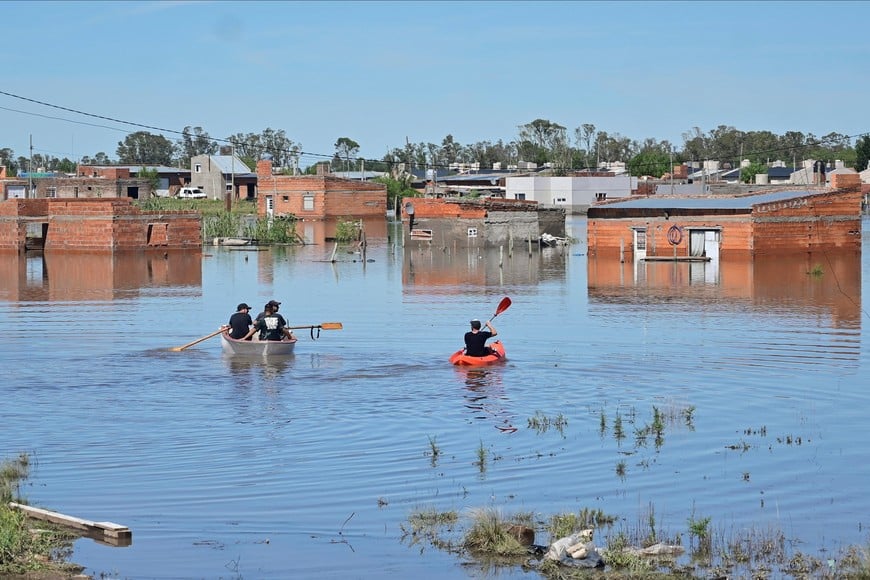 People row kayaks on flooded streets in the city of Bahia Blanca, in the province of Buenos Aires, Argentina March 9, 2025. REUTERS/Juan Sebastian Lobos